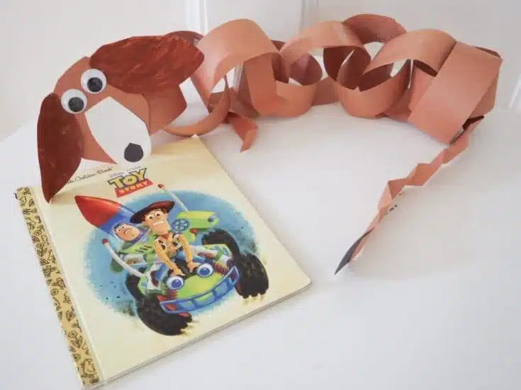 This contains an image of: Slinky Dog Paper Chain: An Easy Toy Story Craft - The Chirping Moms