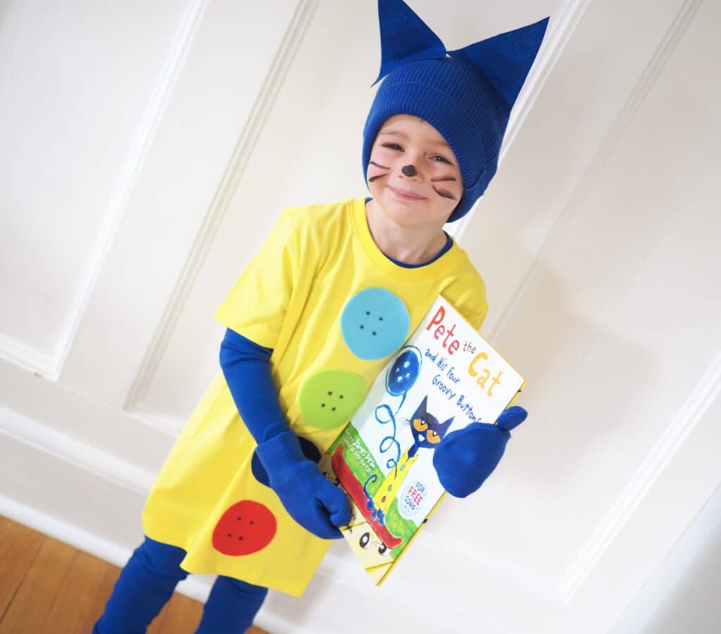 Book Character Day Costume Ideas- Pete the Cat costume with child holding Four Groovy Buttons book