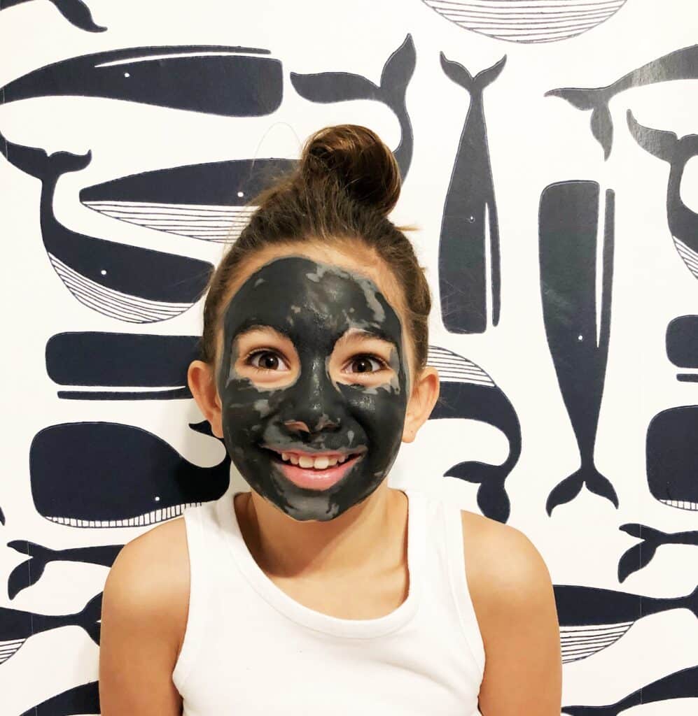 Teen girl with black face mask